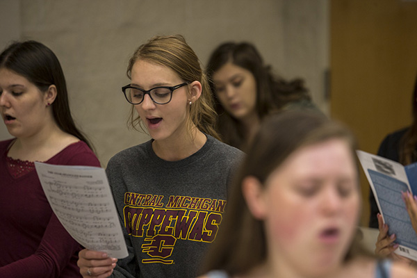 Students singing in choir music class