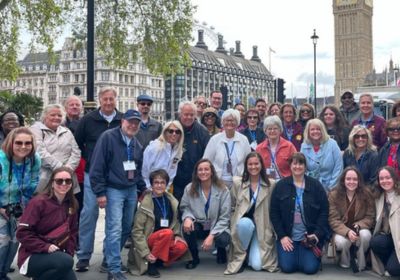 Large group photo of alumni on international travel trip.