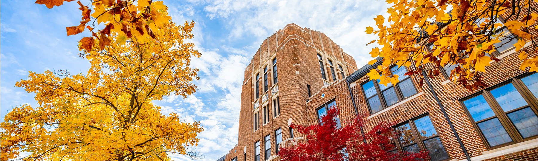 Warriner Hall with autumn leaves.