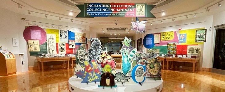 Entrance of the Enchanting Collections exhibit with several large cut-out characters from children's books