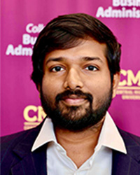 Image of Sumanth Perla, a man, wearing a white collar shirt and black blazer with CMU logo in the background while looking at the camera.