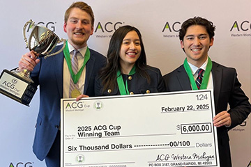 Three students from the winning ACG Cup competition face the camera wearing medals and holding a large trophy and oversized check for $6,000.