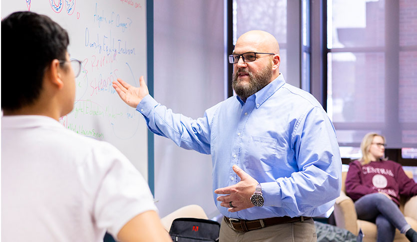 A student receives guidance from a faculty member.