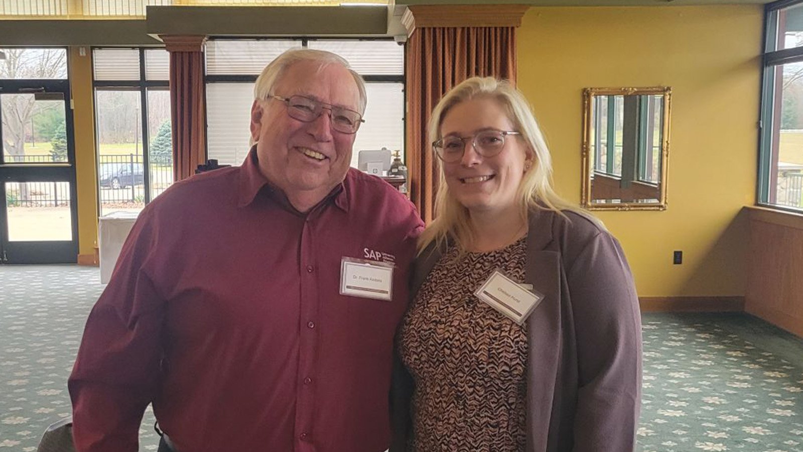 Dr. Frank Andera (left) and Chelsea Hurst (right) pose for a picture at Dow's annual student SAP awards