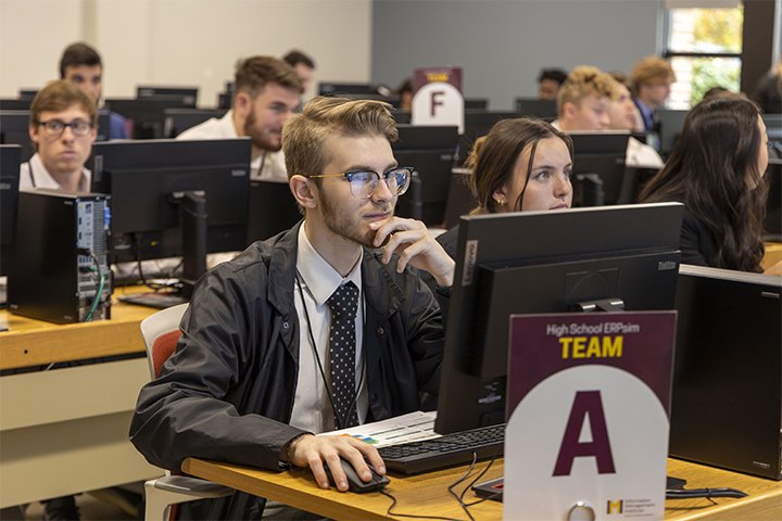 CMU students working in a computer lab while competing in the ERPsim portion of the Logistics Undergraduate Case Competition