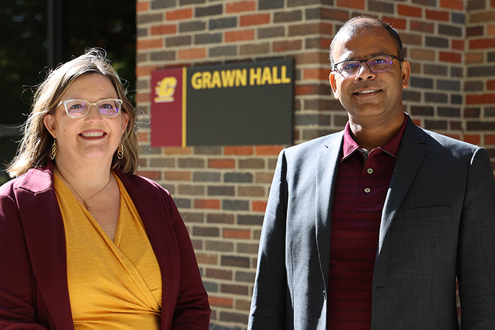 Misty Bennett and Sanjay Kumar outside of Grawn Hall