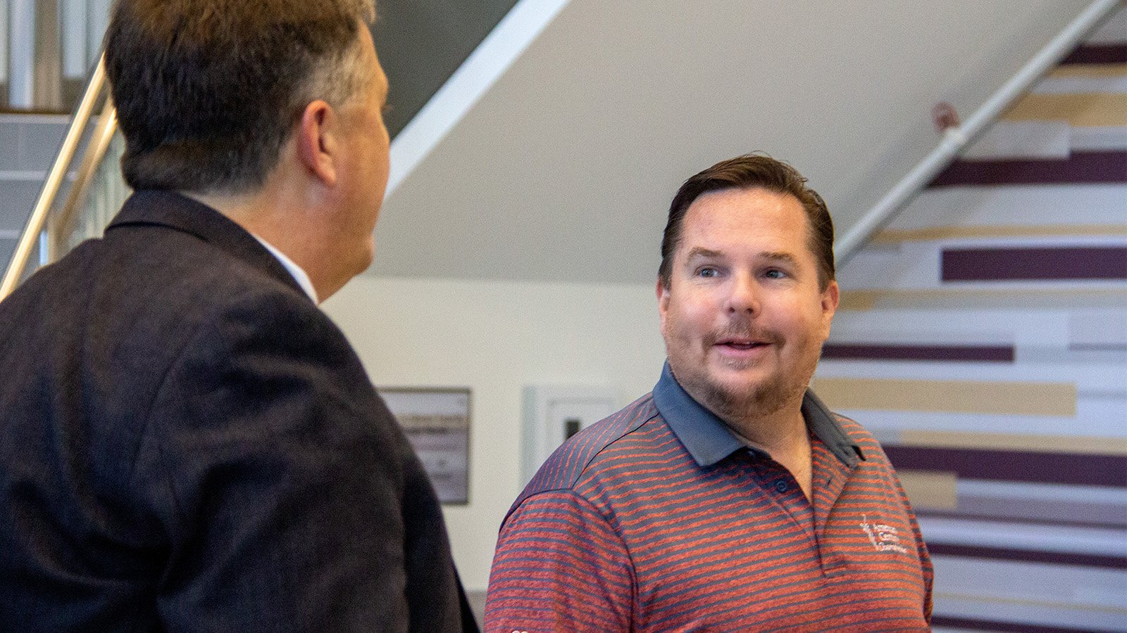 Bob Oros speaking to Chris Moberg in the Grawn's Auditorium.