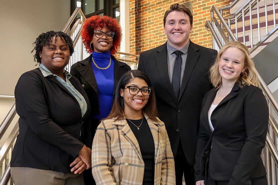 Five students in the Wakeling Gendron Entrepreneurial Scholars program standing in a professional group photo.