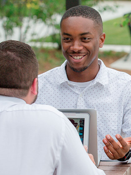 a man holding a tablet