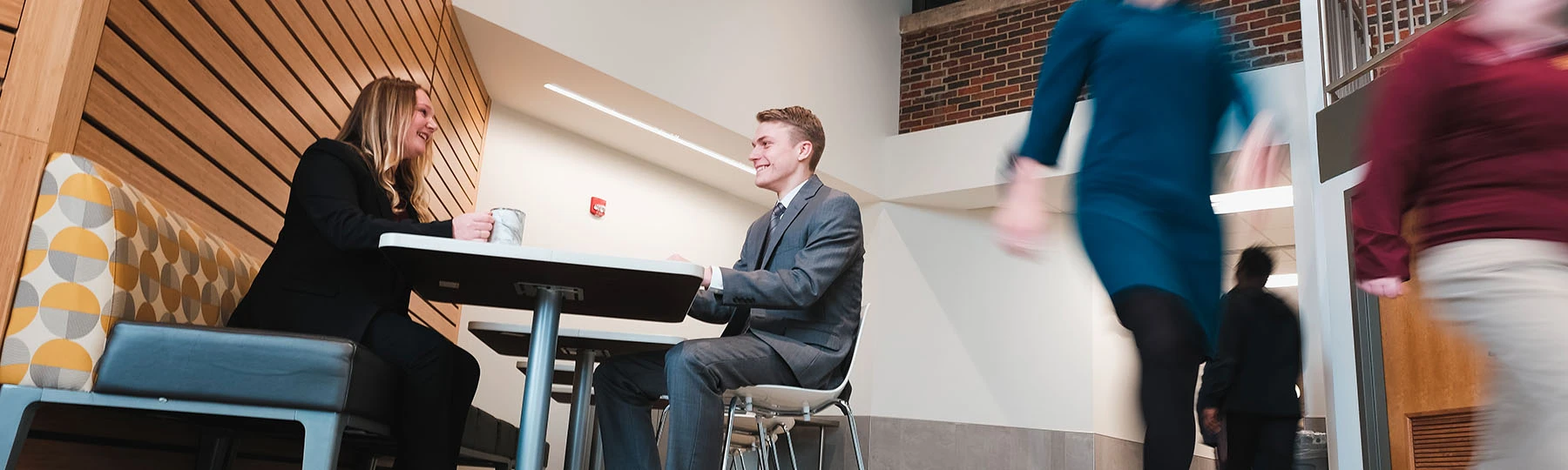 a man in a suit sitting at a desk