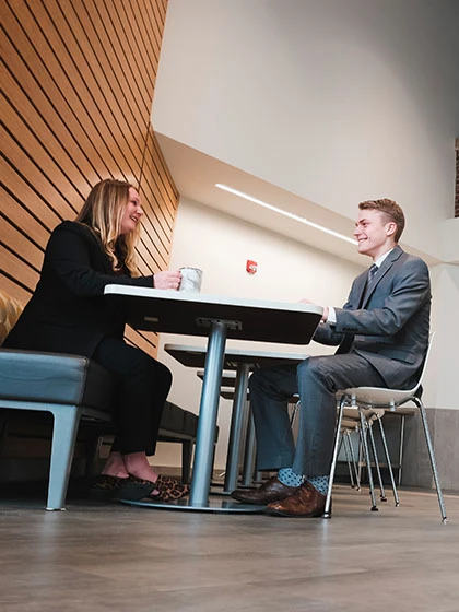 a man and woman sitting at a table