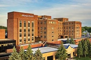 A large brick building with trees.