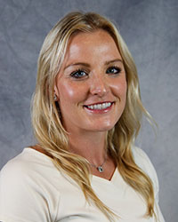 Headshot of Lauren Lowes wearing a white top.