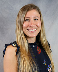 Headshot of Valerie Lamoureux wearing a dark blue blouse.