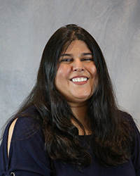 Headshot for Shaija Pandya wearing a blue top.