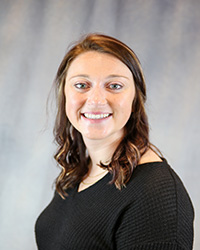 Headshot of McKenzie Schlangen wearing a black top.