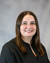 Headshot of Rachel Swanson wearing a black top.