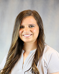 Headshot of Ciara Yoap wearing a light purple top.