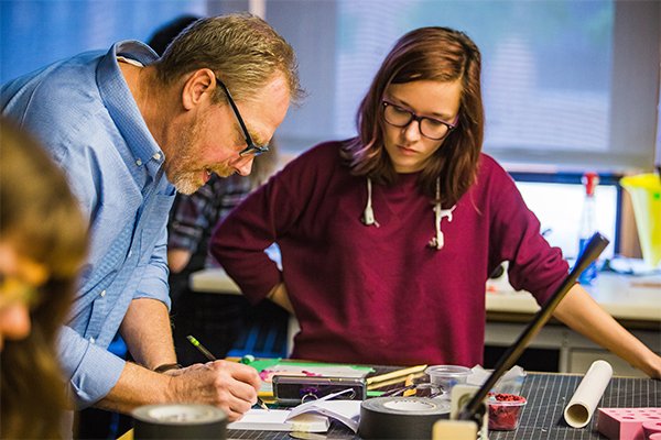 Student and professor in animation lab