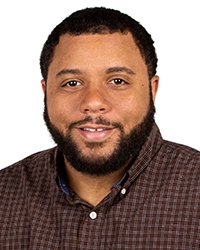 Headshot of Kirkland Crawford on a white backdrop.