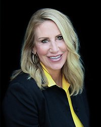 Headshot of Barbara Roethler set to a solid black background.