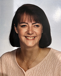 Headshot of Susan Rozman Delia set in front of a white backdrop.