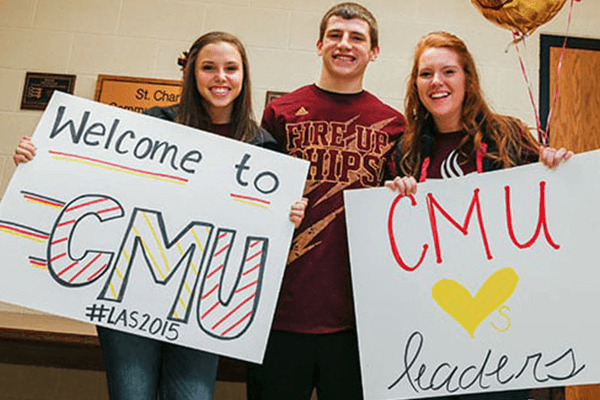 three students holding posters