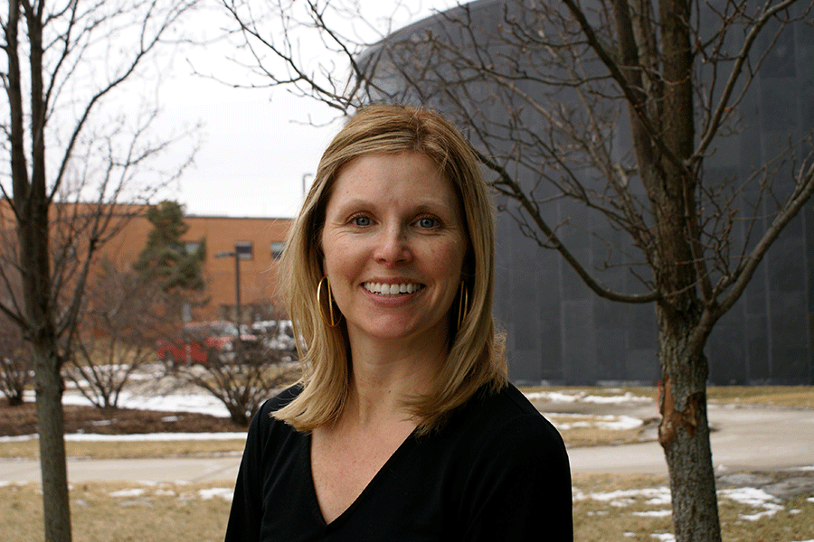 A woman smiling at camera.