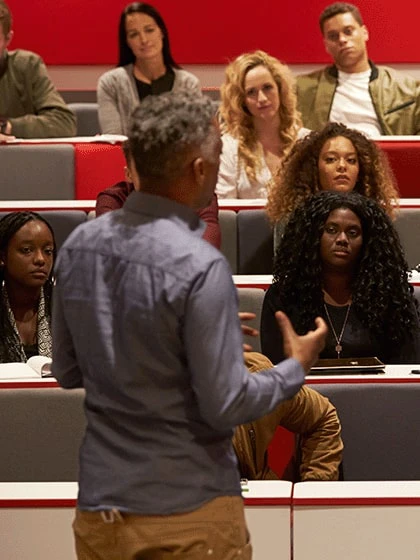 Adult educator in front of a class