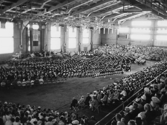 A black and white historic photo of CMU Graduation inside Finch Fieldhouse.