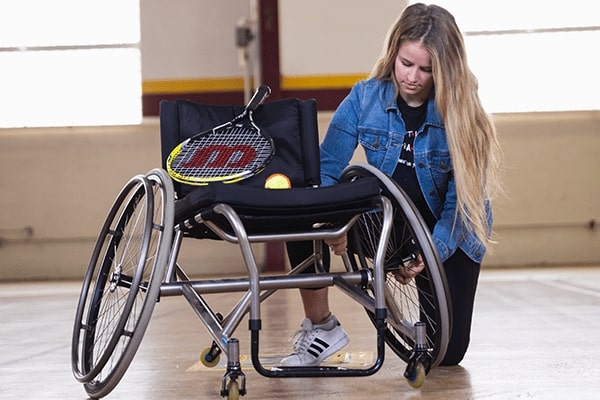 Adaptive wheelchair for tennis.