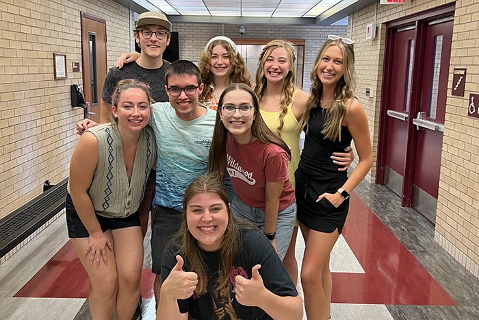 Nonprofit Leadership Student Alliance executive board members stand together in Anspach Hall.