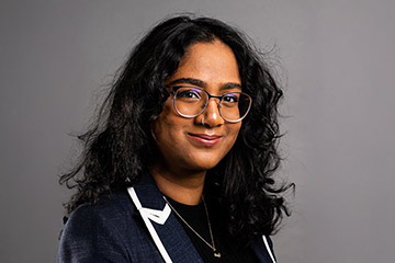 Closeup image of Pravallika Chirumamilla wearing a dark suit jacket