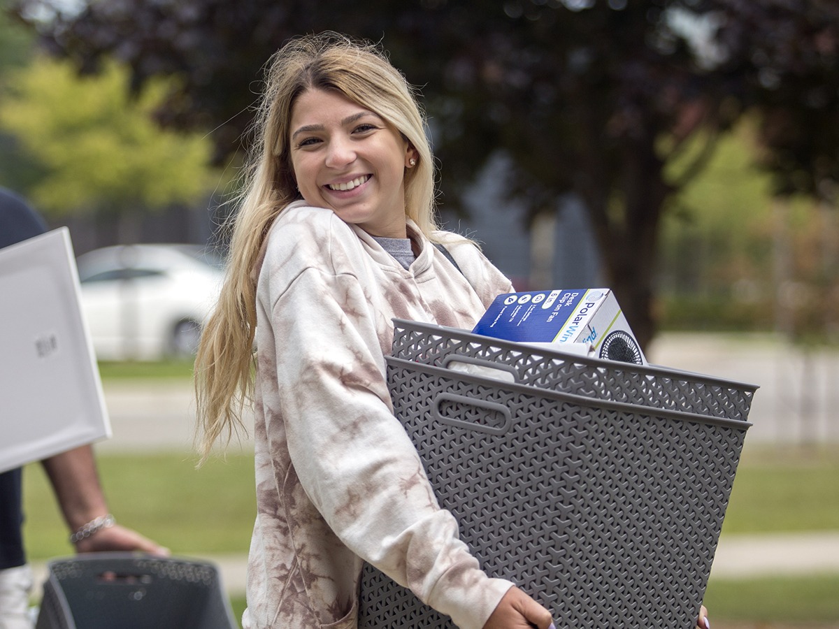 Student moving into Central Michigan University residence hall.