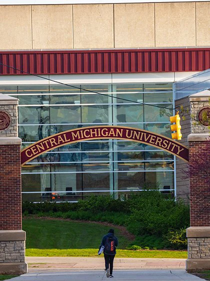 a man walking in front of a building