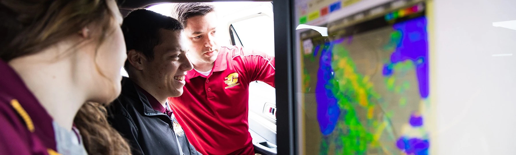 a man looking at a woman in a car