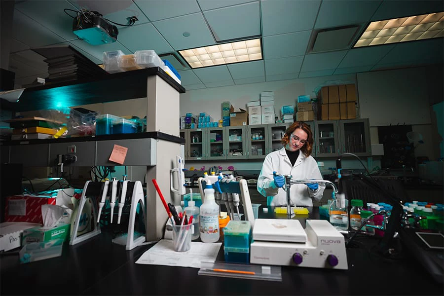 A pre-dentistry student works in a lab on Central Michigan University's campus.