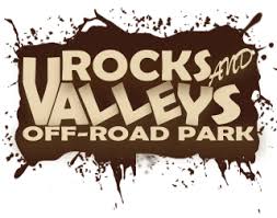 A brown and white logo for Rocks and Valleys Off Road Park.