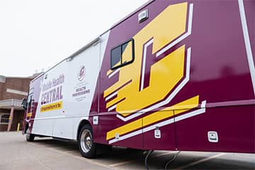 A side view of the Mobile Health Central bus.