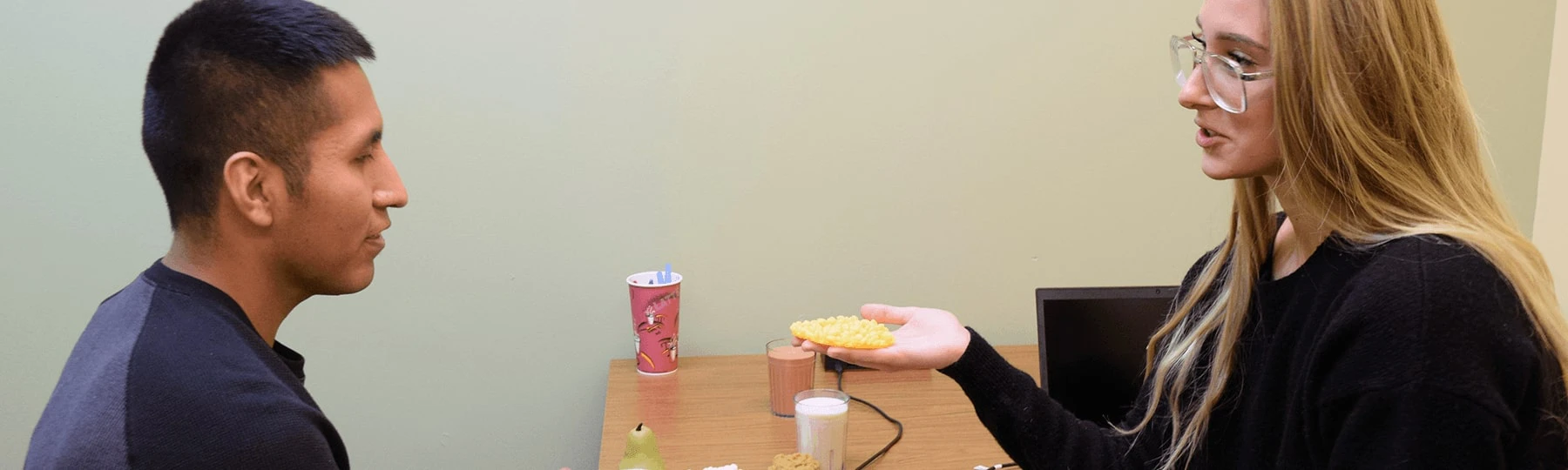 Dietetics students weighing food