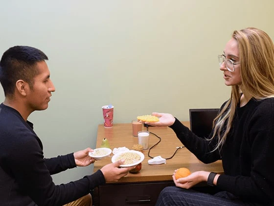 Dietetics students weighing food