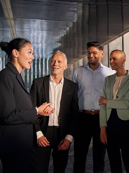 An individual talking to a group of people.