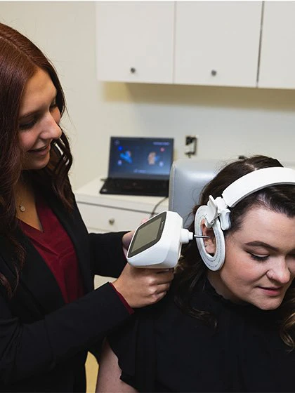 Person having their hearing checked