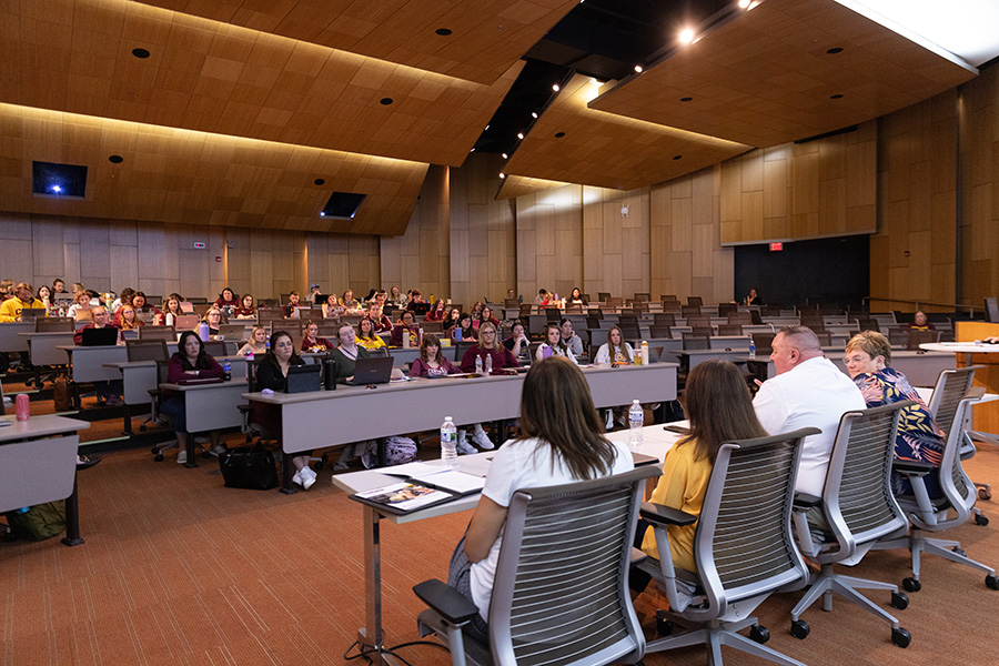 Teacher candidate conference in the French Auditorium in the Education and Human Services building.