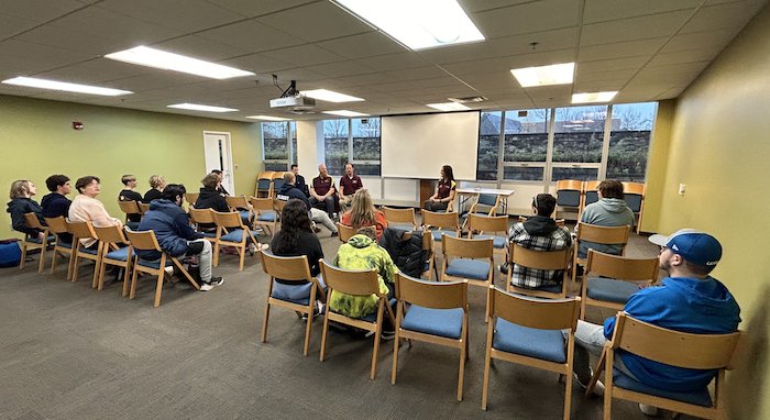 OIT team members present to and interact with local high school students as part of a campus orientation and tour.