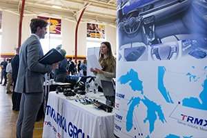 a man and woman at a career fair