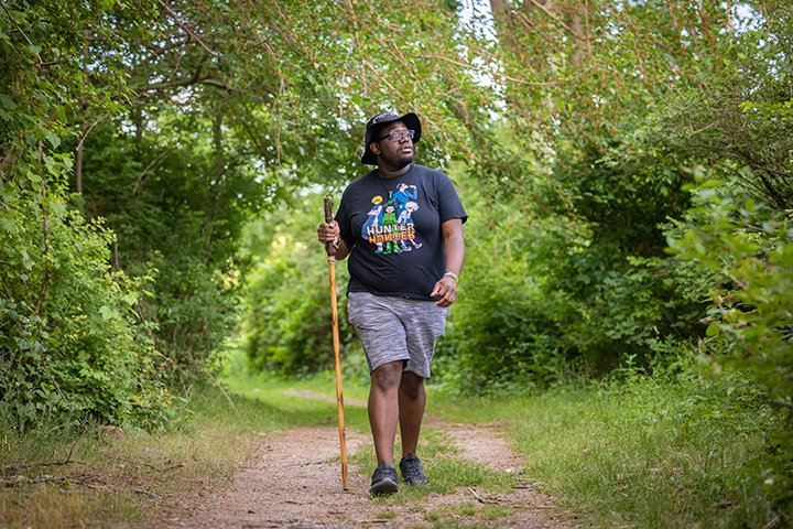 Student Jaie Jones goes for a hike through Deerfield Park in Mt. Pleasant.