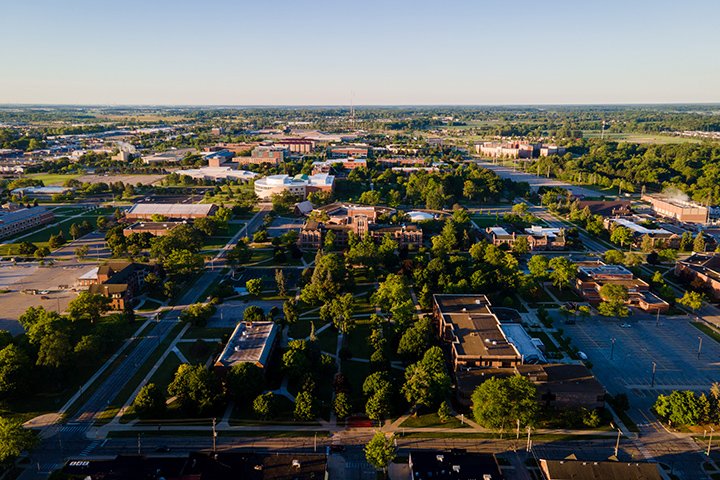 An aerial view of Central Michigan University’s campus during the golden hour, just after sunrise.