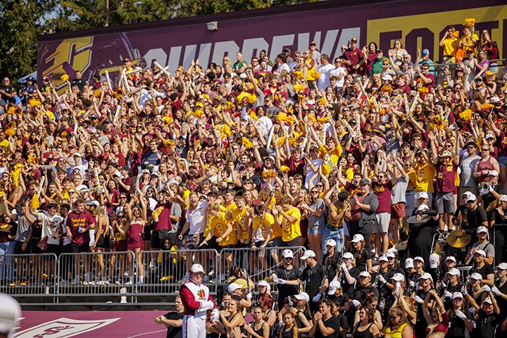 Hundreds of CMU students cheer from the stands during the CMU football game against Eastern Michigan.