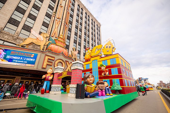 A wide angle view of the CMU Thanksgiving parade float as it goes by the Fox Theatre.